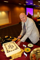 Jim Fordemwalt cuts the birthday cake