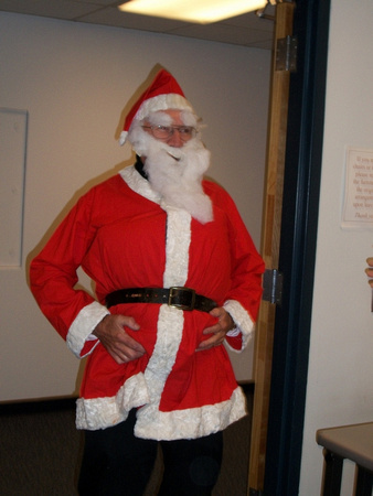 Dr. Malcolm Comeaux as Santa