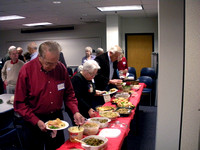 Ed Scanlon, Carol and Ted Cary in the food line.